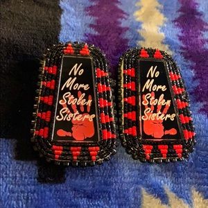 Hand made no more stolen sisters earrings